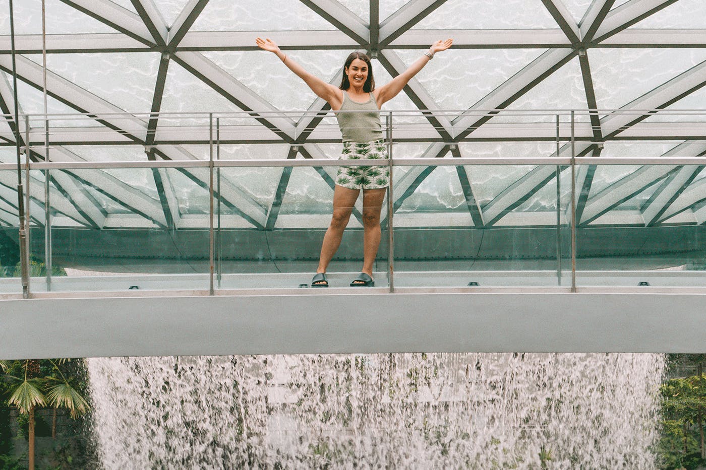 Polly Markus in front of the HSBC Rain Vortex at Jewel Changi Airport